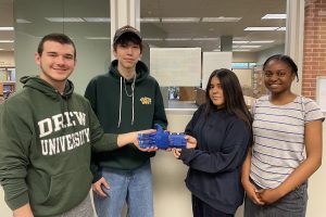 Drew Students with the prosthetic hand they built.