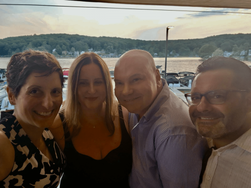 Frances “Fran” Caggiano-Swenson C’98, Heather (McMurchie) Champagne C’98, Frank Ruggerio C’97, and Luigi Mennella C’98 celebrating Frank’s birthday